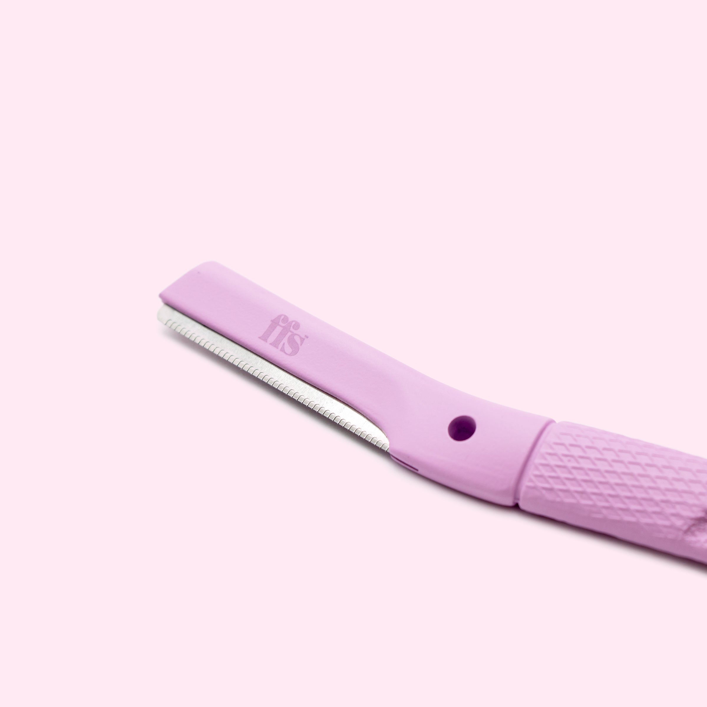 FFS dermaplaning blade head close-up showing precision serrated edge in flamingo pink #Colour_Flamingo Pink