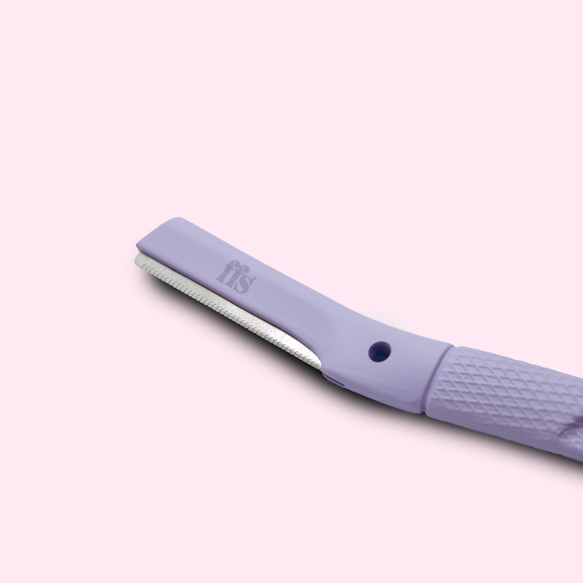 FFS dermaplaning blade head close-up showing precision serrated edge in coral purple #Colour_Coral Purple